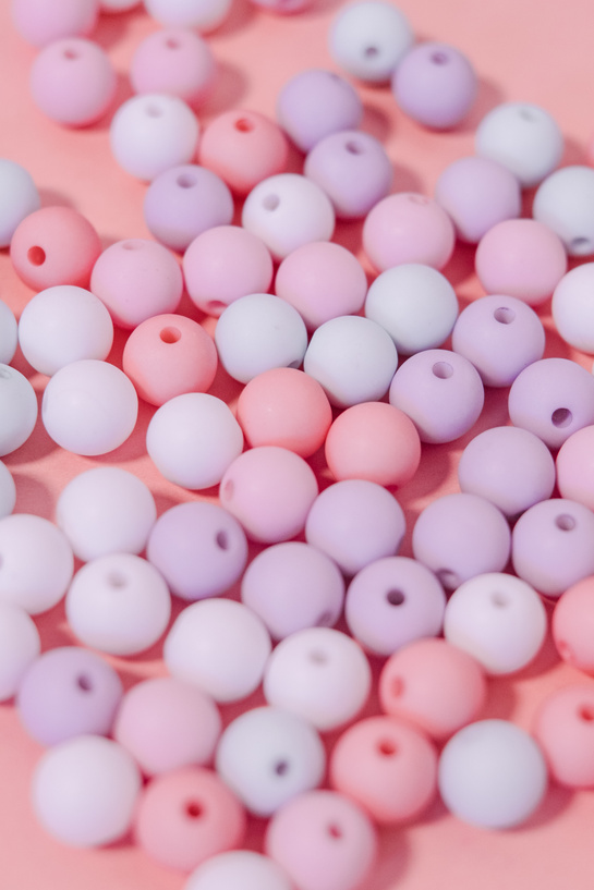 Colorful Beads on Pink Background