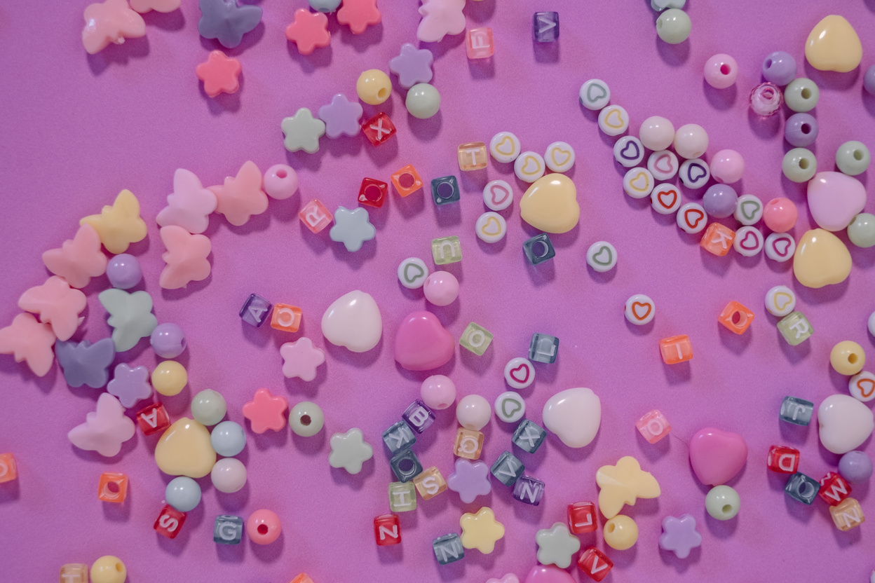 Colorful Beads on Pink Background